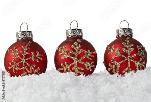 Photo: Three Red Christmas Ornaments With Golden Snowflakes On Snow Three Red Christmas Ornaments With Golden Snowflakes On Snow