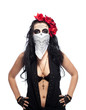Photo: Serious woman in day of the dead mask hide face Serious woman in day of the dead mask hide face