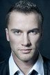 Close-up portrait of young handsome man with green eyes Close-up portrait of young handsome man with green eyes