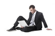 Handsome young businessman sitting with the notebook Handsome young businessman sitting with the notebook