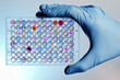 Hand with a microplate