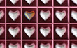 Silver candy hearts with one golden