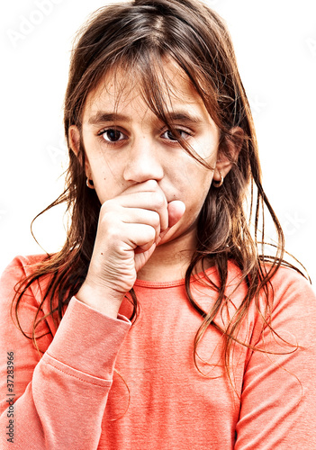 Photo: Small girl coughing isolated on a white background Small girl coughing isolated on a white background