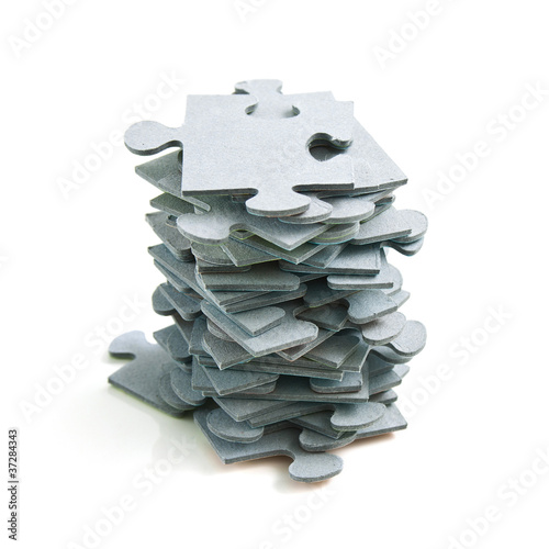 Photo: Stack of Puzzle Pieces on White Background Stack of Puzzle Pieces on White Background
