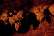 Cave interior with stalagmites and exotic colors