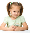 Cute little girl with paper money - dollars