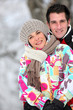 Couple huddling together on a winter's day Couple huddling together on a winter's day