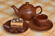 Foto: Teapot, a cup of tea, cakes and sweets Teapot, a cup of tea, cakes and sweets