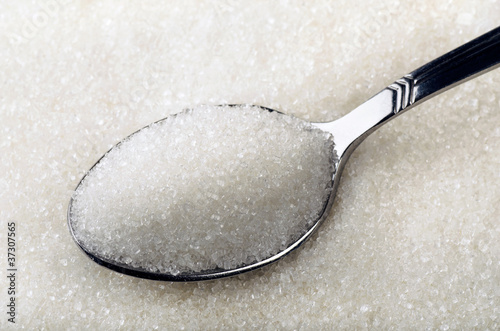 Photo: Tea spoon of white granulated sugar Tea spoon of white granulated sugar