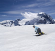 Snowboarder descends a slope Snowboarder descends a slope