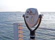 Public beach binoculars on a dock at sunset, Florida. Public beach binoculars on a dock at sunset, Florida.