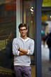 Cool young man in front of urban setting