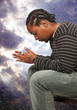 Photo: Black man praying Black man praying