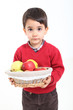Photo: Child bring basket fruit Child bring basket fruit