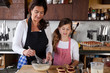Mother and daughter baking at home Mother and daughter baking at home