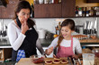 Mother and daughter baking at home Mother and daughter baking at home