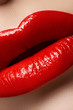 Photo: Macro of lips with bright fashion red makeup. Bloody lipstick Macro of lips with bright fashion red makeup. Bloody lipstick