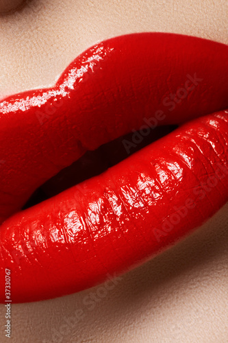 Photo: Macro of lips with bright fashion red makeup. Bloody lipstick Macro of lips with bright fashion red makeup. Bloody lipstick