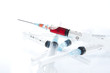 A 2ml syringe and needle. Blur