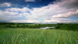 summer landscape in the background of running clouds.