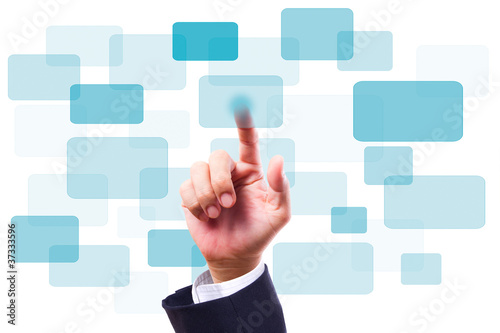 Photo: Hand pushing button on screen Hand pushing button on screen