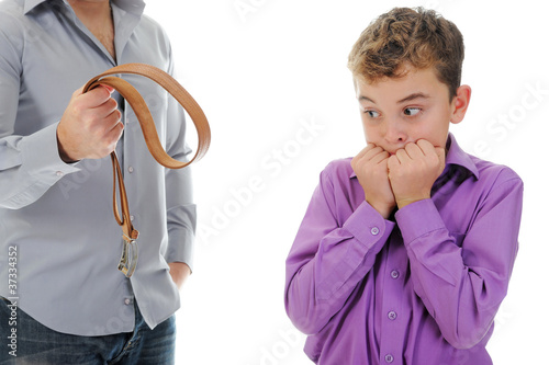 Photo: Strict father punishes his son Strict father punishes his son