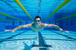Swimmer in the Pool floating Underwater