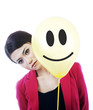 Attractive sad businesswoman  behind a smiley face