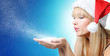 Christmas blonde young girl, blowing snow