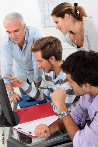 Photo: Mature students looking at a computer screen Mature students looking at a computer screen