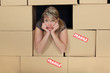 Bored woman surrounded by boxes