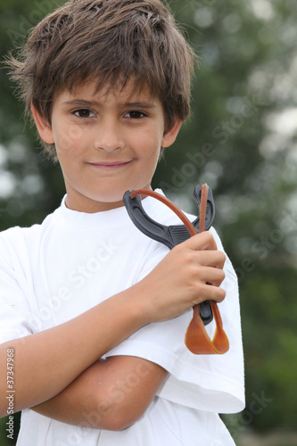 Photo: Little boy holding catapult Little boy holding catapult
