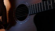 Musician strumming guitar