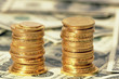 gold coins on the dollar backgrond gold coins on the dollar backgrond