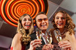 People with champagne in a bar