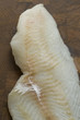 Raw Cod on a wooden butcher