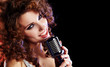 Portrait of a glamorous girl with mike singing song Portrait of a glamorous girl with mike singing song