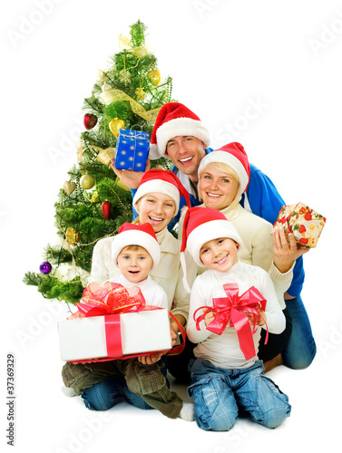 Photo: Christmas Family isolated on white Christmas Family isolated on white