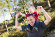 Photo: Young Laughing Father and Child Piggy Back Young Laughing Father and Child Piggy Back