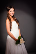 Beautiful dark haired woman in white bridal dress