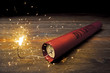 Lit dynamite stick on the floor