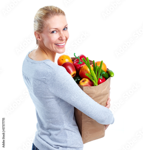 Photo: Young woman with a grocery shopping bag. Young woman with a grocery shopping bag.