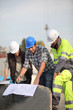Construction workers looking at site plans