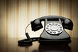 Vintage telephone over striped wallpaper