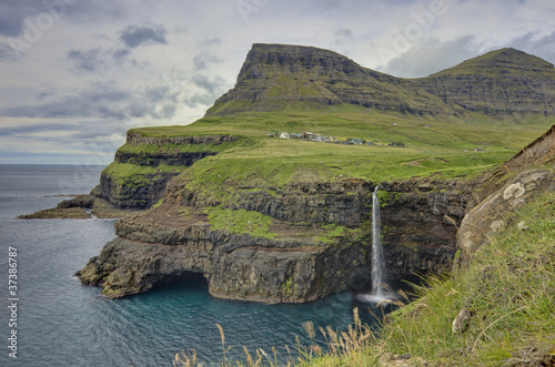 Photo: Steep green hills in the Faroe Islands Steep green hills in the Faroe Islands