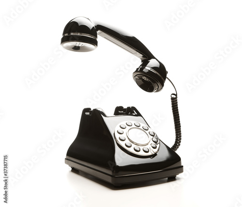 Photo: Retro telephone on white background Retro telephone on white background