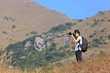 photographer taking photo in country side