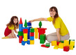 Happy mother and daughter playing with blocks