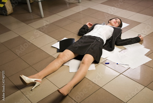 Photo: Lifeless businesswoman in a office Lifeless businesswoman in a office