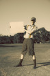 Retro Golf Player Holding Banner